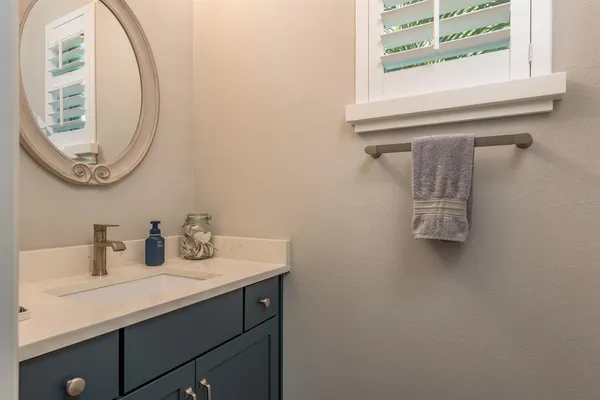 a kitchen with a washing machine and cabinets