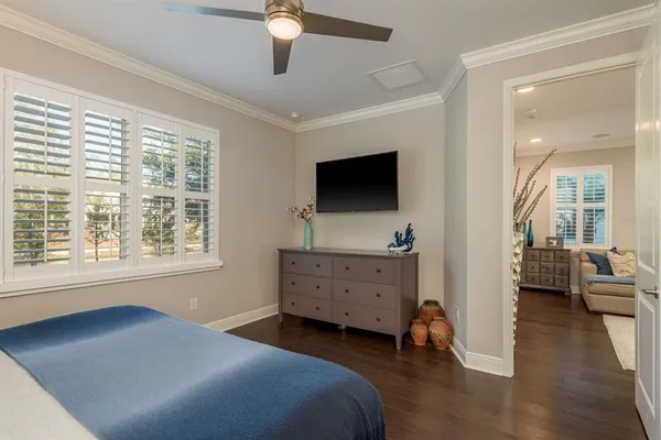a bedroom with a bed and a lamp