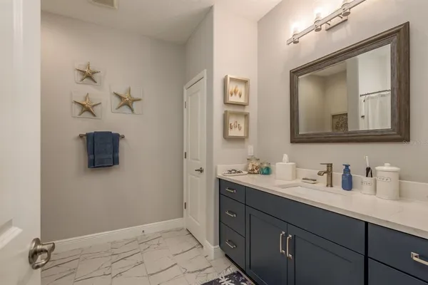 a bathroom with a bathtub a shower and a window