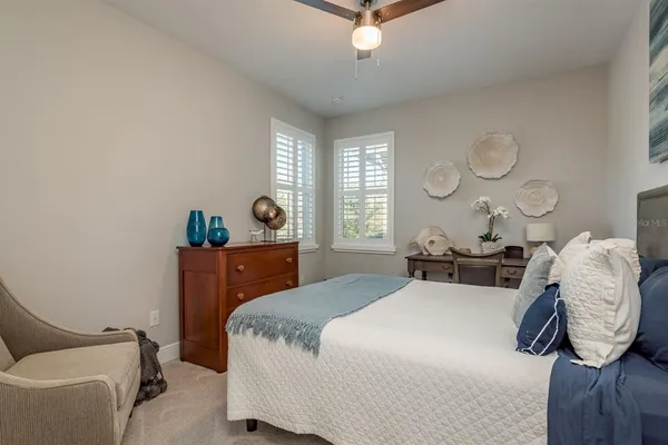a bedroom with a bed and a couch