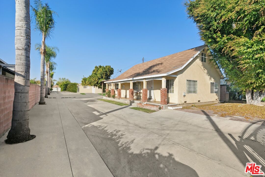 15615 South White Avenue Compton, CA 90221 - Photo 1 of 8 a view of a white house with a patio