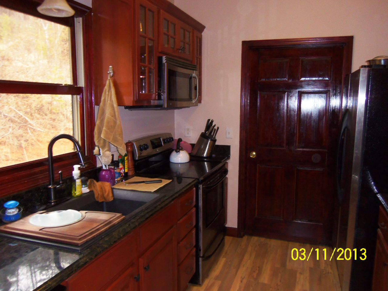 3210 Seneca Hollow Road Elliston, VA 24087 - Photo 11 of 40 a kitchen with a sink and a stove top oven