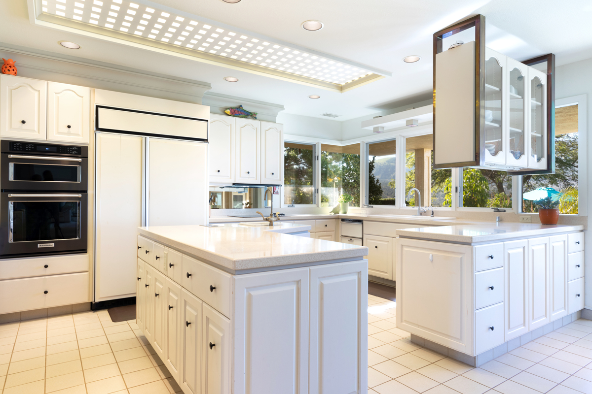 71-1638 Puu Napoo Drive Kailua-Kona, HI 96740 - Photo 11 of 30 a kitchen with stainless steel appliances kitchen island granite countertop a sink and cabinets