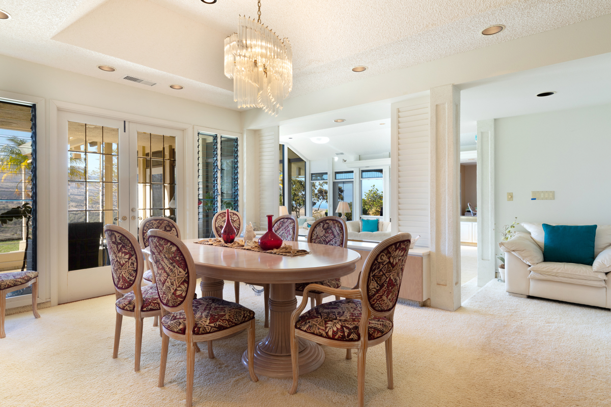 71-1638 Puu Napoo Drive Kailua-Kona, HI 96740 - Photo 17 of 30 a dining room with furniture a chandelier and wooden floor