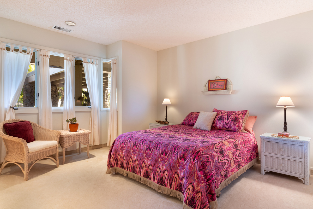 71-1638 Puu Napoo Drive Kailua-Kona, HI 96740 - Photo 24 of 30 a bedroom with a bed and wooden floor