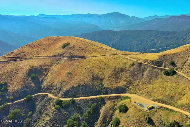 a view of a pool with a yard