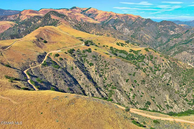 a view of a swimming pool with a mountain