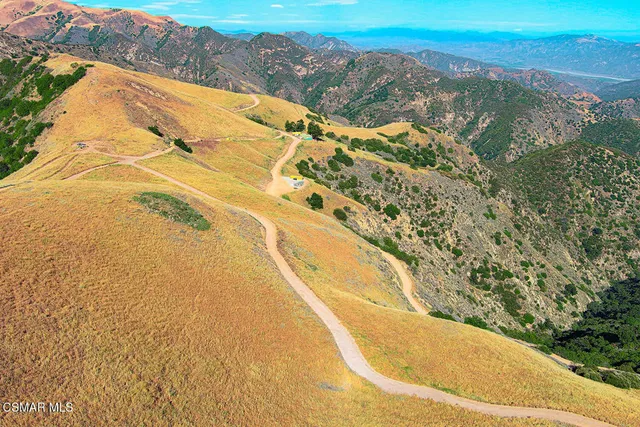 a view of a yard with an ocean