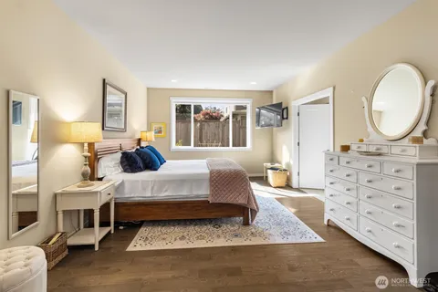 a living room with furniture a large window and a table