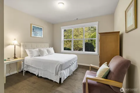 a bedroom with bed and a window