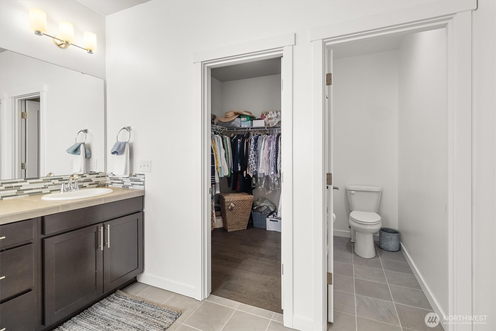2712 Coho Lane Anacortes, WA 98221 - Photo 17 of 34 a bathroom with a granite countertop sink toilet and shower