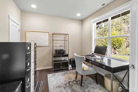 a room with furniture wooden floor and a window