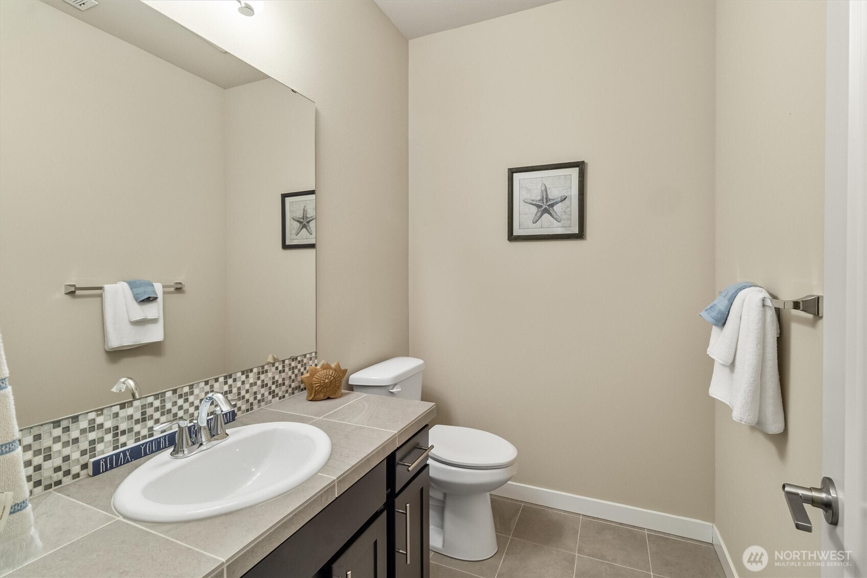 2712 Coho Lane Anacortes, WA 98221 - Photo 23 of 34 a bathroom with a sink toilet and a mirror