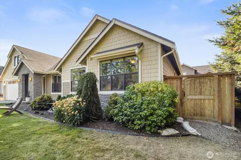 a front view of a house with garden