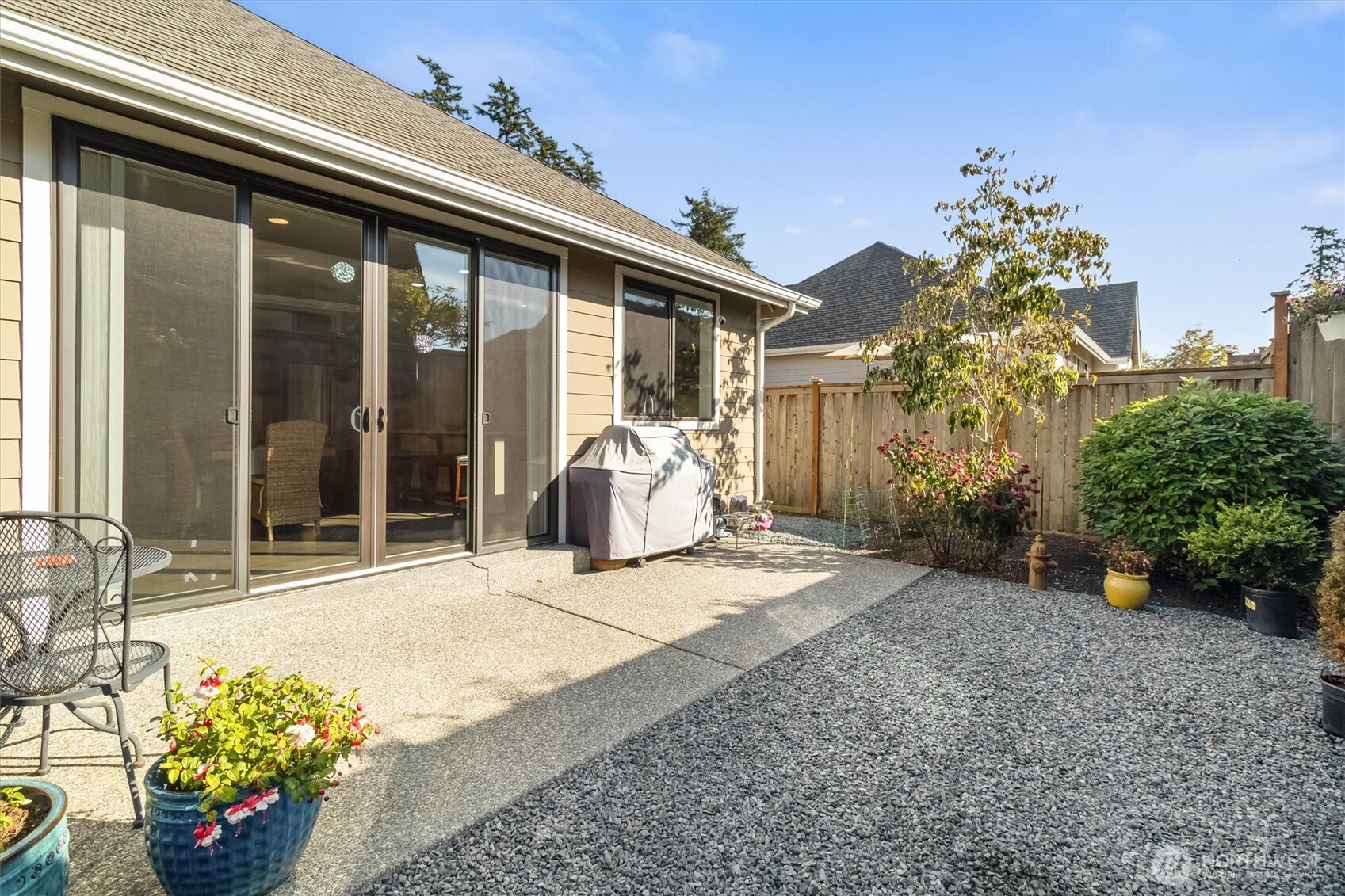 2712 Coho Lane Anacortes, WA 98221 - Photo 25 of 34 a view of a house with a flower garden