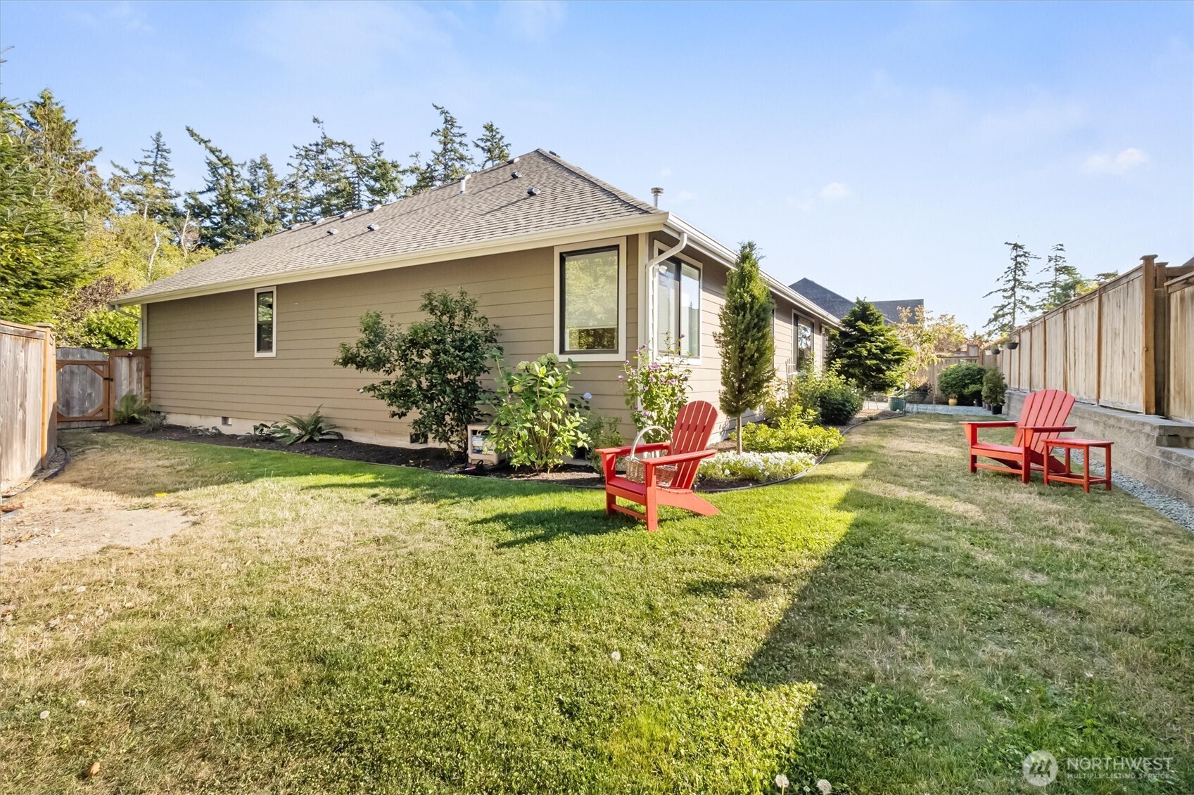 2712 Coho Lane Anacortes, WA 98221 - Photo 27 of 34 a view of a house with backyard porch and sitting area