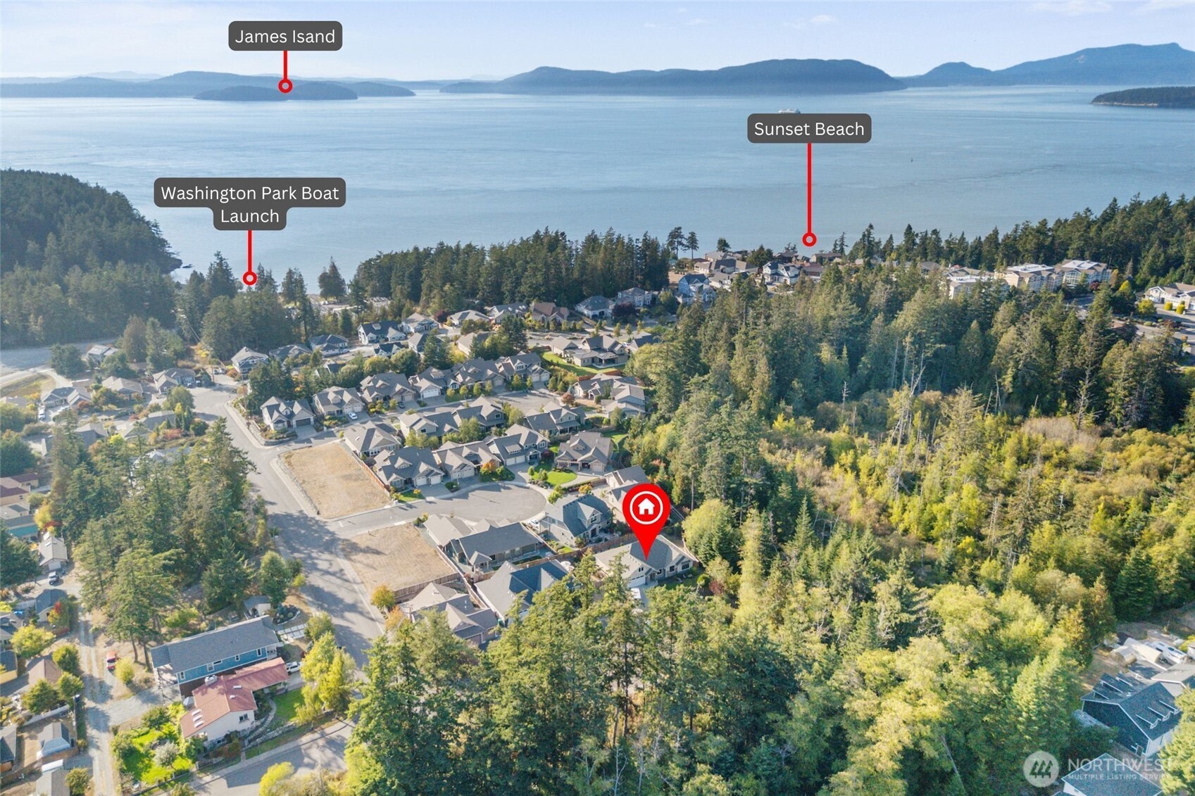 2712 Coho Lane Anacortes, WA 98221 - Photo 29 of 34 a city view with lake and houses in the back