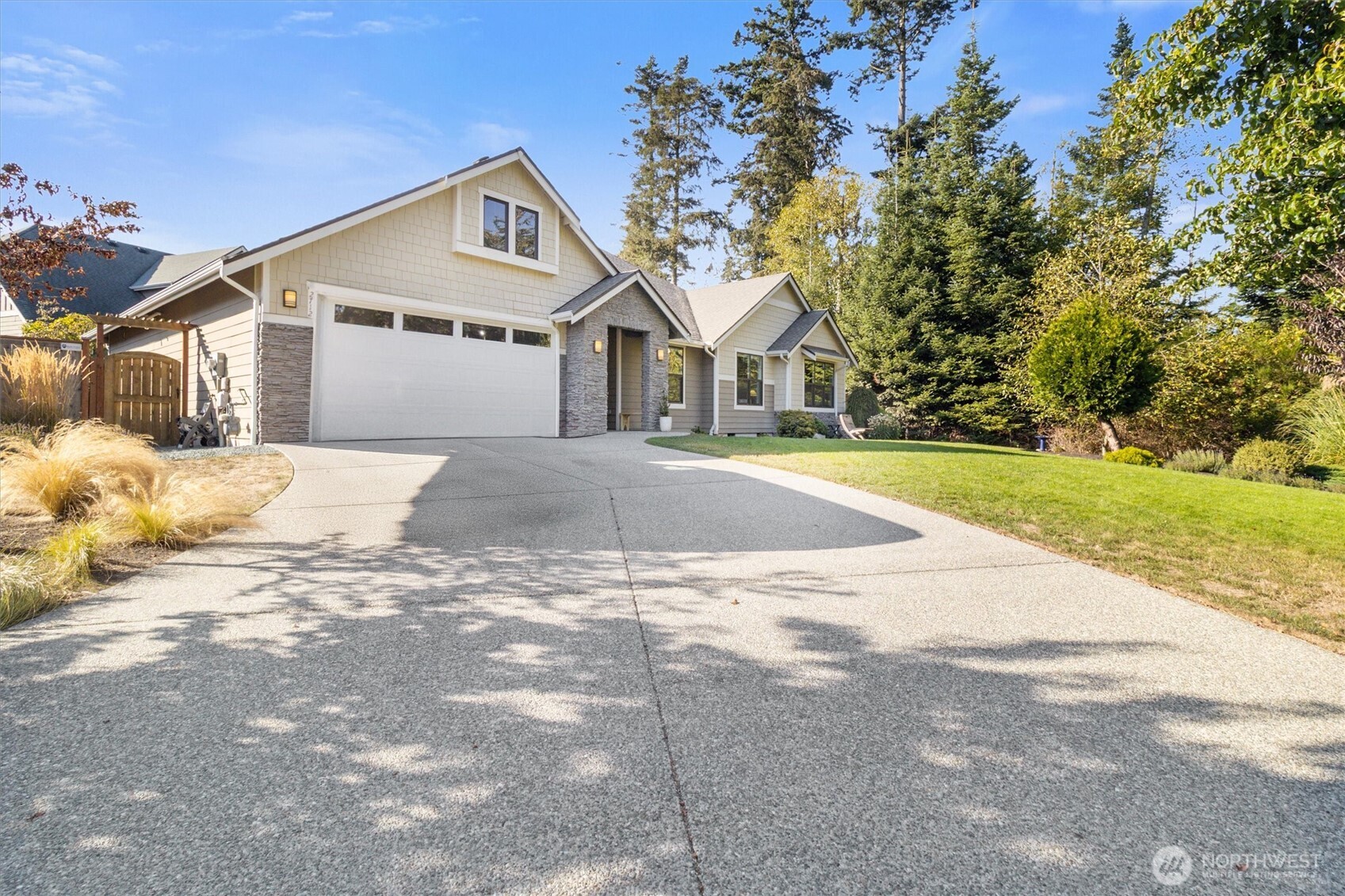 2712 Coho Lane Anacortes, WA 98221 - Photo 33 of 34 a front view of a house with a yard and garage