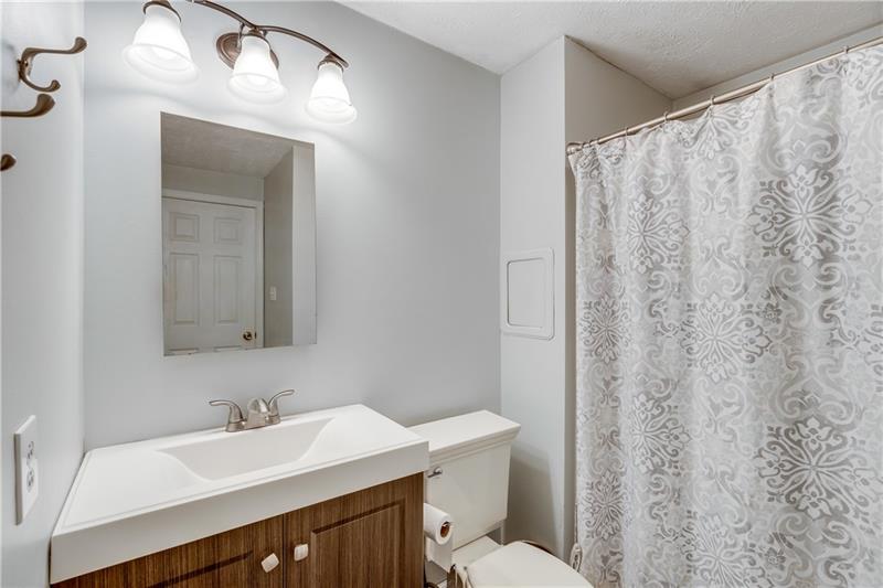 319 Ritter Road South Sewickley, PA 15143 - Photo 14 of 23 The master bathroom is light and bright. Laundry chute is an extra bonus.