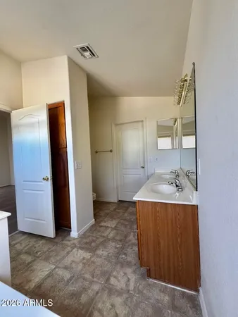 a view of a bathroom with a sink and mirror