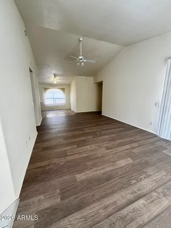 a view of a room with wooden floors and lots of counter top space