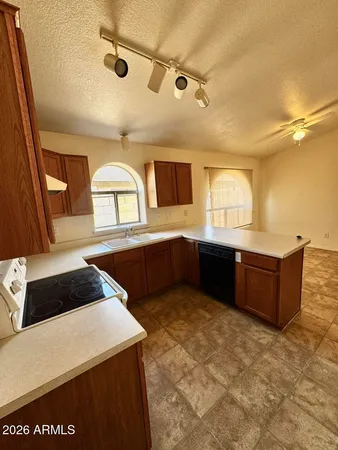 a kitchen with stainless steel appliances a sink and a microwave