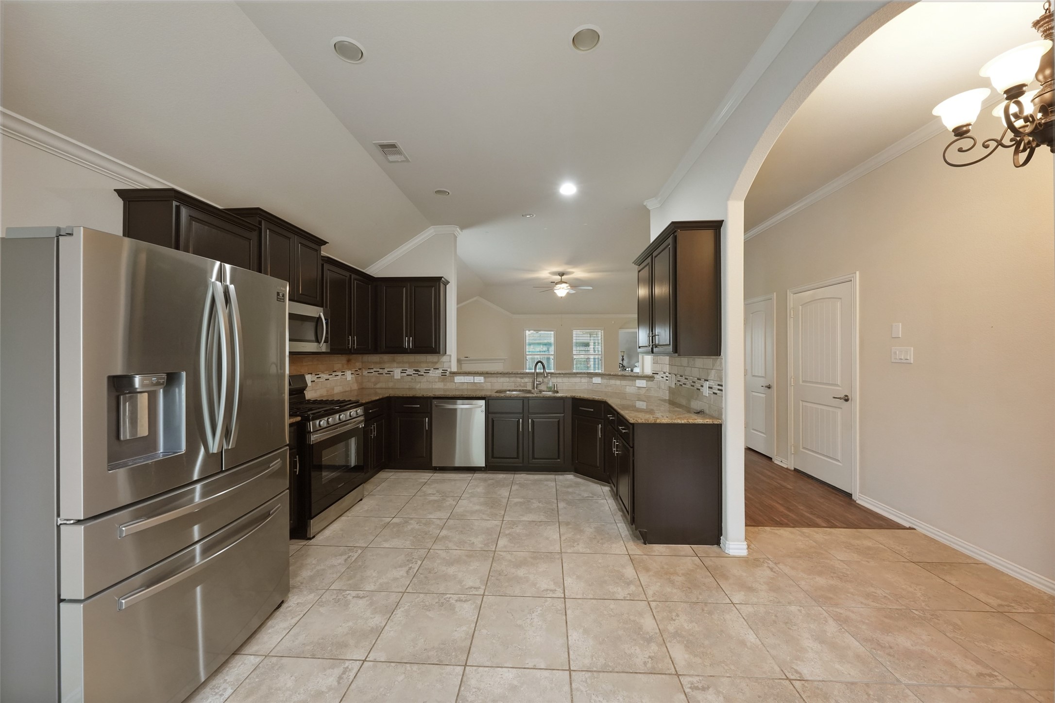 24138 McKinzie Ridge Drive Porter, TX 77365 - Photo 8 of 24 From the kitchen, open view to the Family Room, perfect for Family Gatherings and Entertainment.