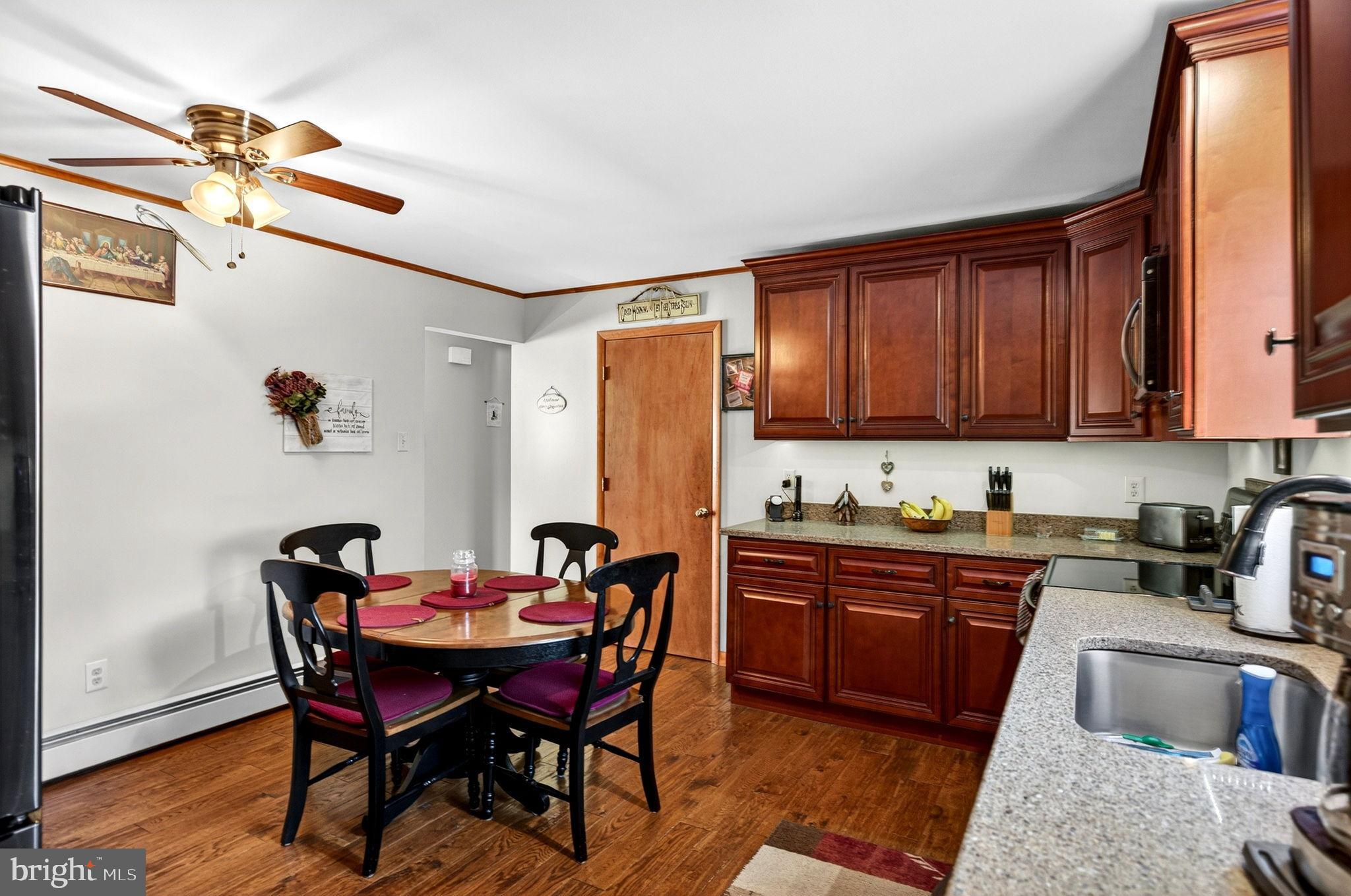 854 Lily Lake Road Wapwallopen, PA 18660 - Photo 14 of 36 Cozy kitchen with rich wood accents.