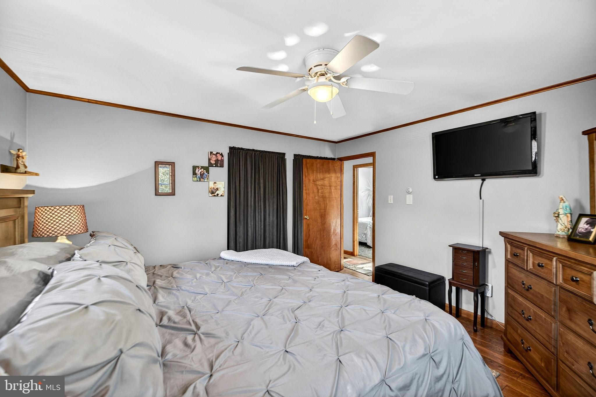 854 Lily Lake Road Wapwallopen, PA 18660 - Photo 20 of 36 Cozy bedroom with warm wooden accents.