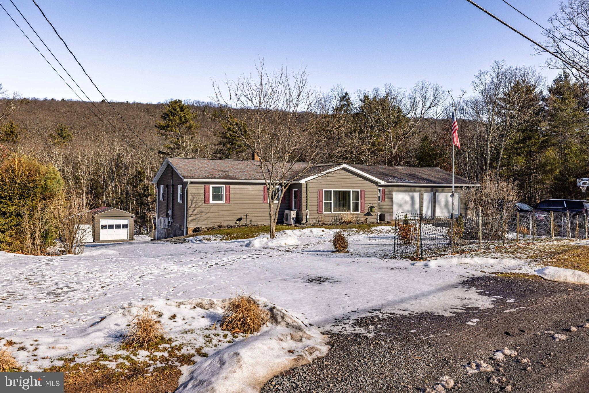 854 Lily Lake Road Wapwallopen, PA 18660 - Photo 2 of 36 Charming home nestled in a snowy landscape.
