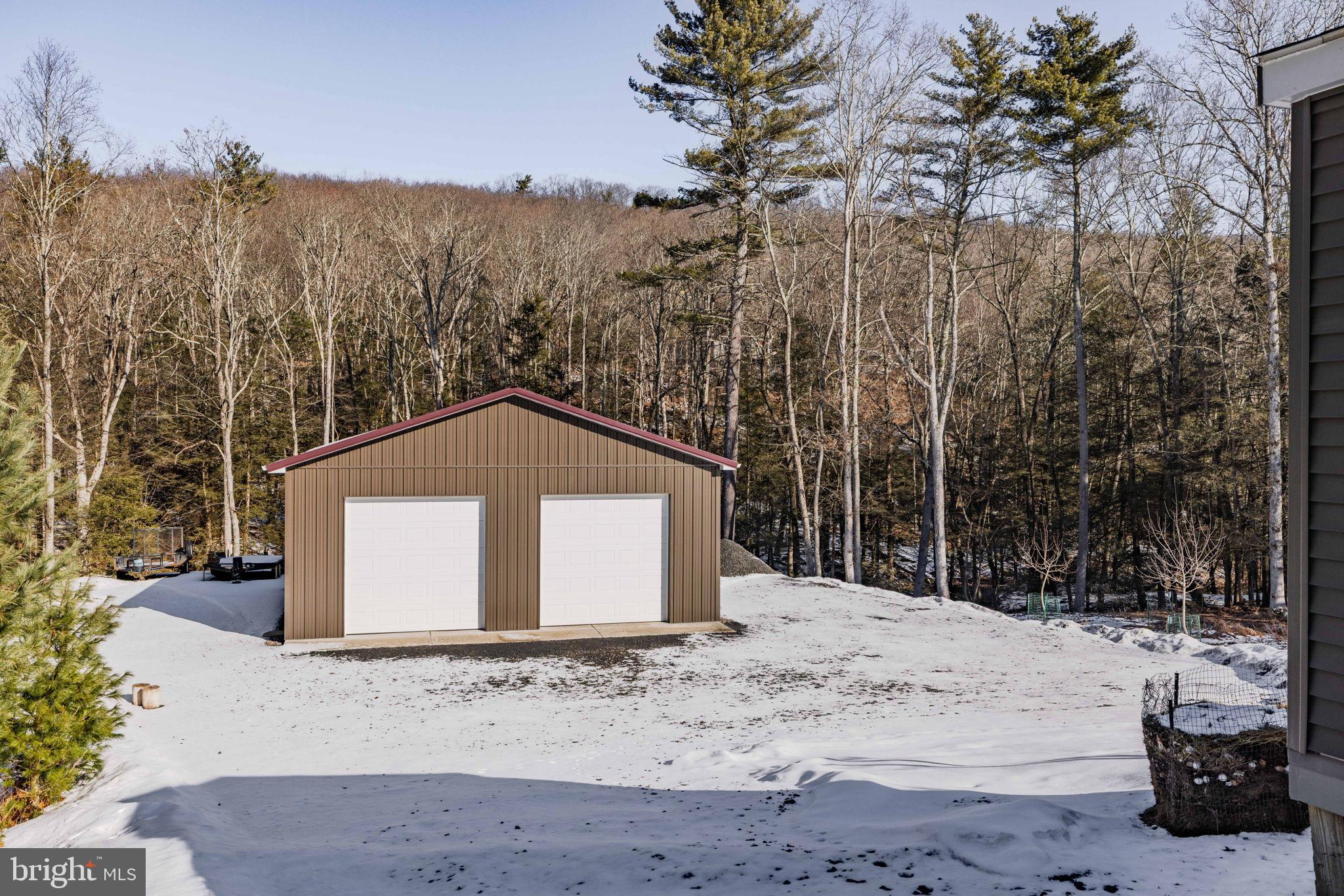 854 Lily Lake Road Wapwallopen, PA 18660 - Photo 32 of 36 Charming outbuilding nestled in a snowy landscape.
