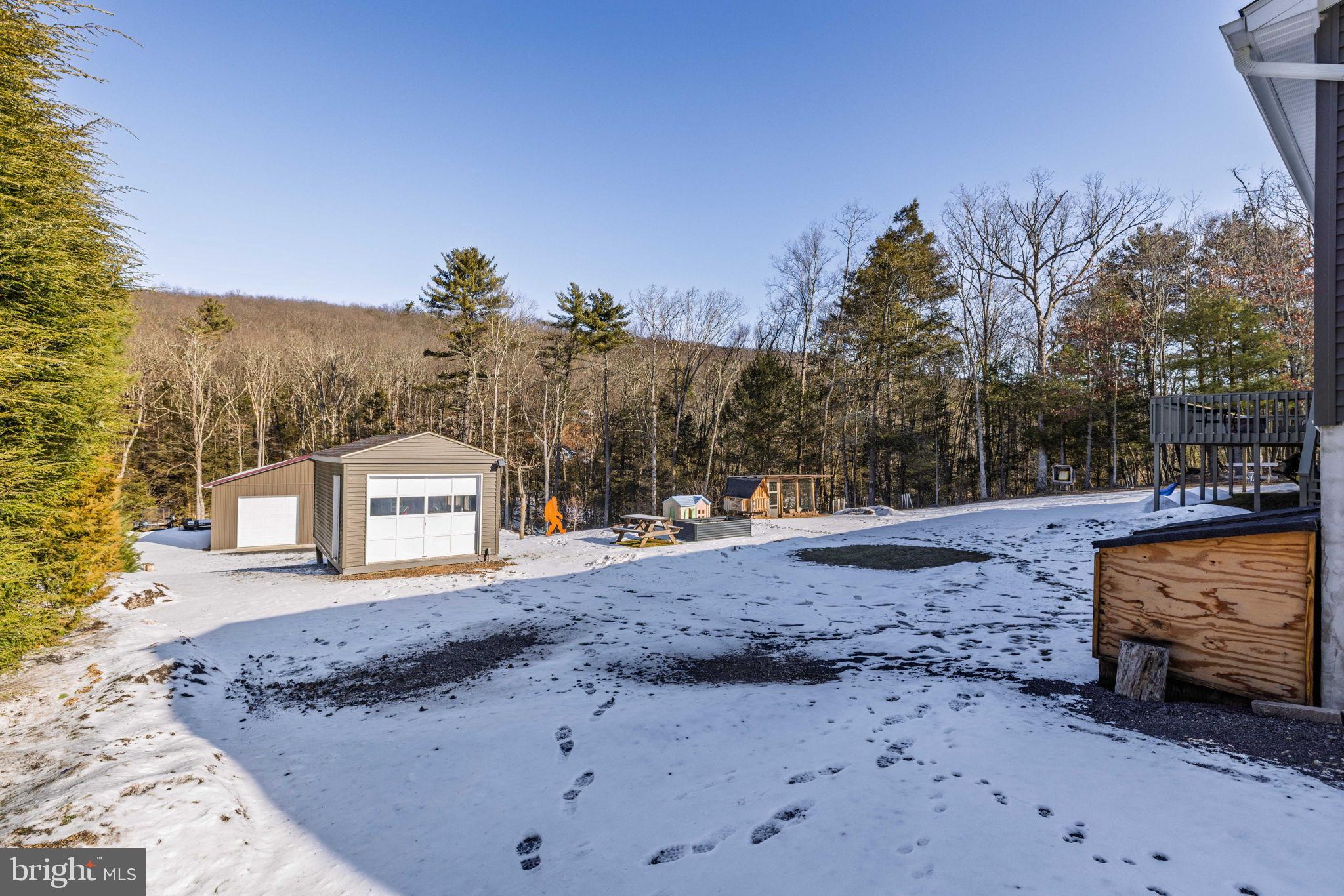 854 Lily Lake Road Wapwallopen, PA 18660 - Photo 8 of 36 Serene winter landscape with a cozy shed.