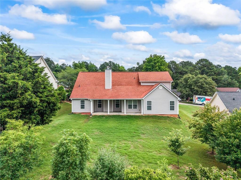 241 Red Bud Road Jefferson, GA 30549 - Photo 41 of 43 a view of a house with a yard and sitting area