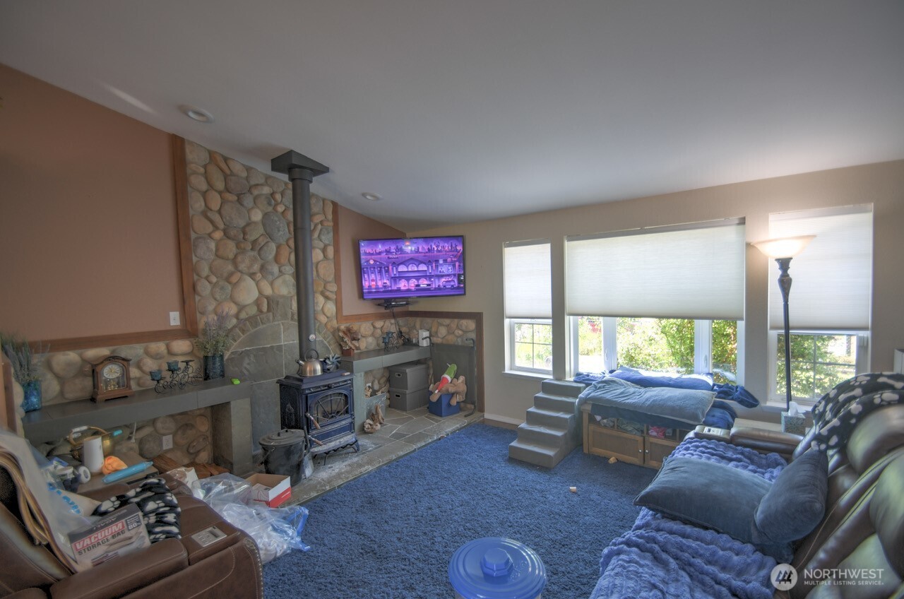 5922 184th Lane Southwest Rochester, WA 98579 - Photo 5 of 34 a living room with furniture and a fireplace