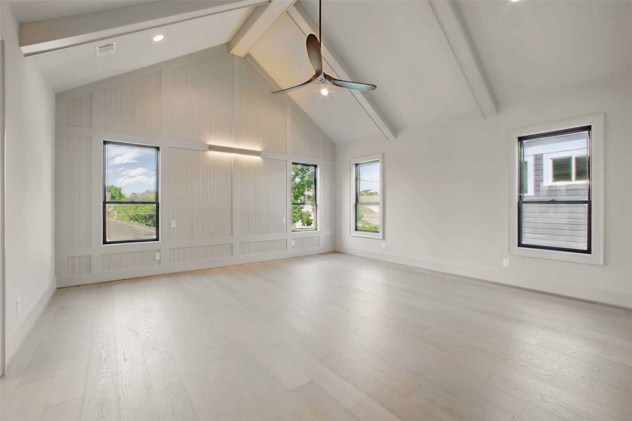 8619 Cedarbrake Drive Spring Valley Village, TX 77055 - Photo 16 of 31 an empty room with wooden floor and windows
