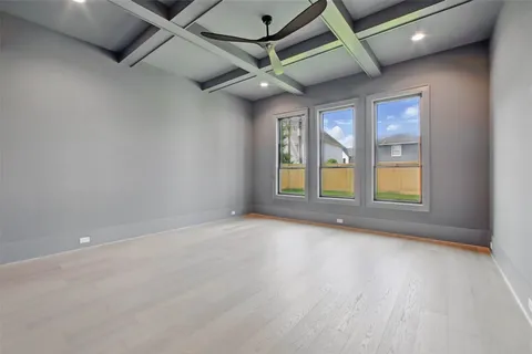 a view of a big room with windows and closet