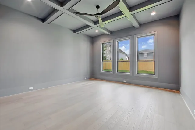 a view of a big room with windows and closet