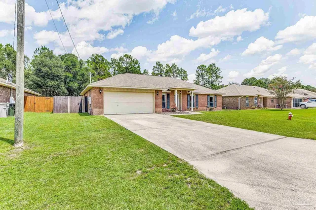 a house with garden in front of it