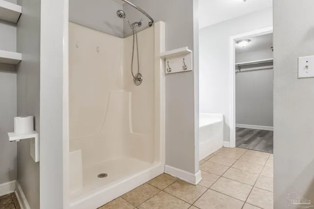 a bathroom with a shower and toilet