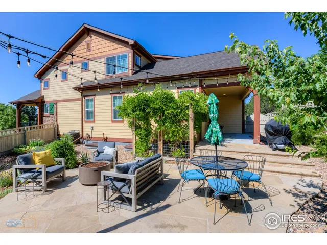 a view of a backyard with sitting area