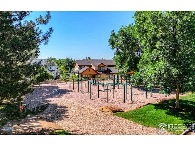 a view of a park with large trees
