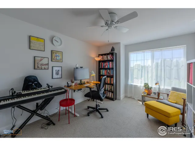 a workspace with furniture and a book shelf