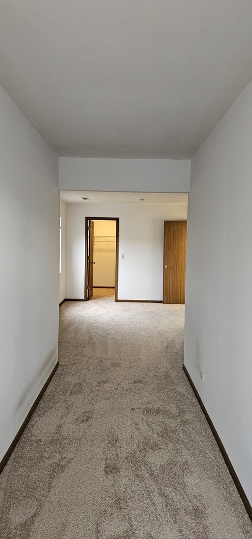 301 Village Creek Drive, Unit 2A Lake In The Hills, IL 60156 - Photo 14 of 31 a view of empty room
