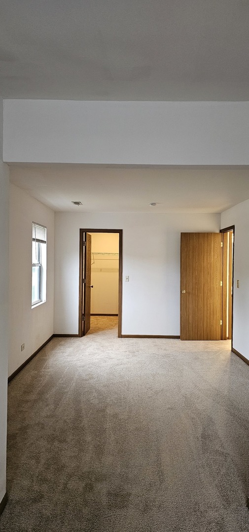 301 Village Creek Drive, Unit 2A Lake In The Hills, IL 60156 - Photo 16 of 31 a view of empty room