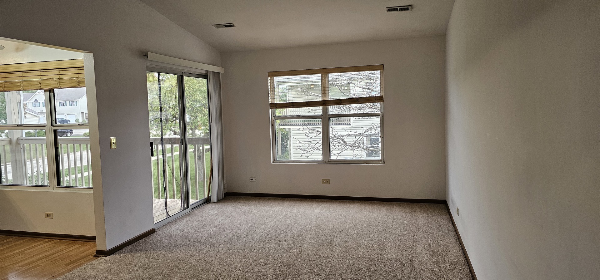 301 Village Creek Drive, Unit 2A Lake In The Hills, IL 60156 - Photo 2 of 31 an empty room with windows and closet