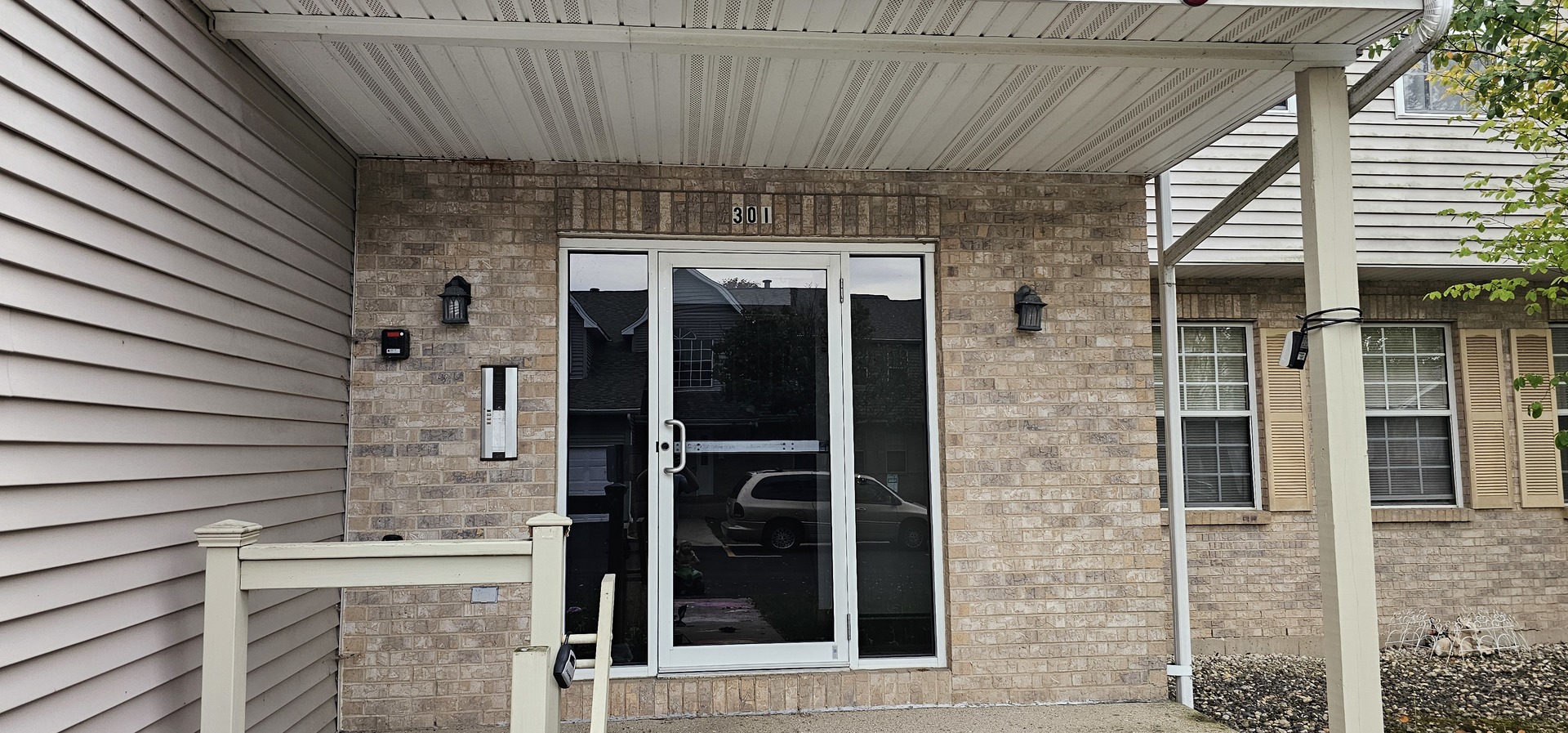 301 Village Creek Drive, Unit 2A Lake In The Hills, IL 60156 - Photo 29 of 31 a view of a door of the house and a window
