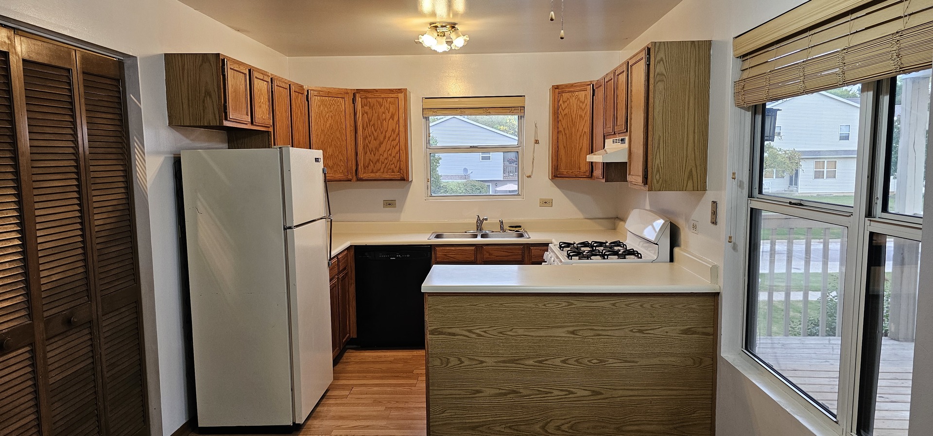 301 Village Creek Drive, Unit 2A Lake In The Hills, IL 60156 - Photo 4 of 31 a kitchen with stainless steel appliances granite countertop a refrigerator and a sink