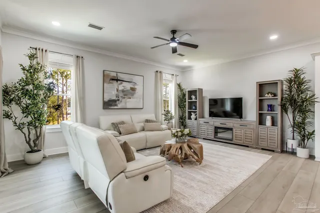 a living room with furniture kitchen and a window