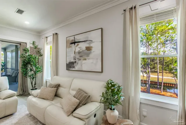 a kitchen with stainless steel appliances kitchen island granite countertop a stove a sink a refrigerator and a dining table with wooden floor