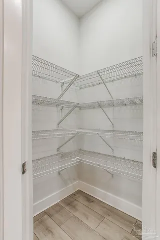 a en suite bathroom with a toilet a sink and a mirror